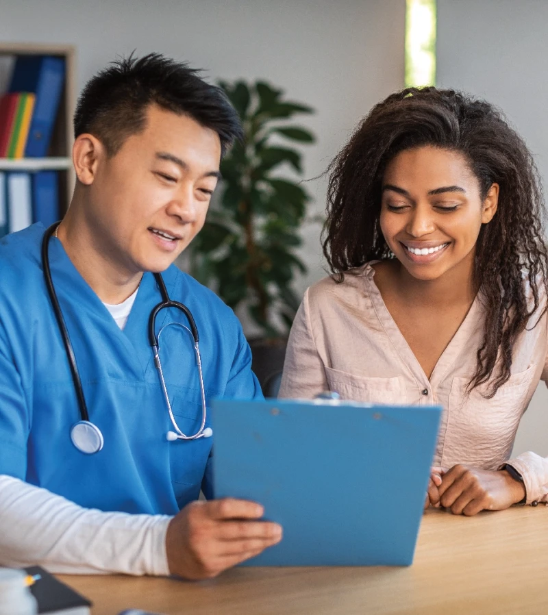 A doctor showing test result to patient